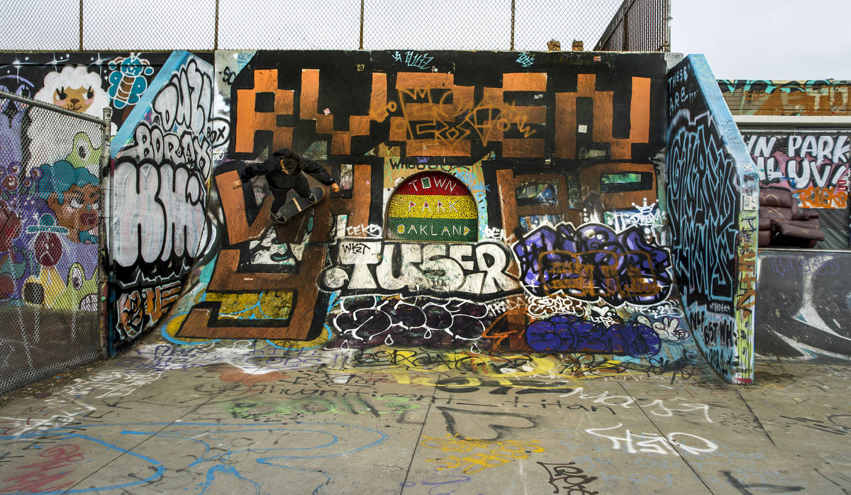 A skateboarder navigates a ramp at DeFremery Park skate park on Friday, July 2, 2021, in Oaklan ...