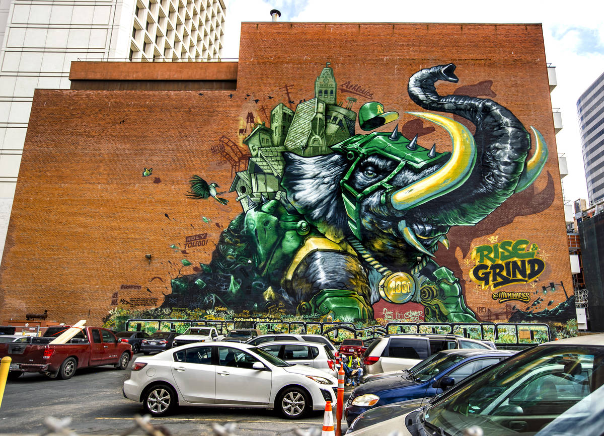 The Illuminaries, a local street art crew, spent three weeks spray painting the 105-foot mural ...