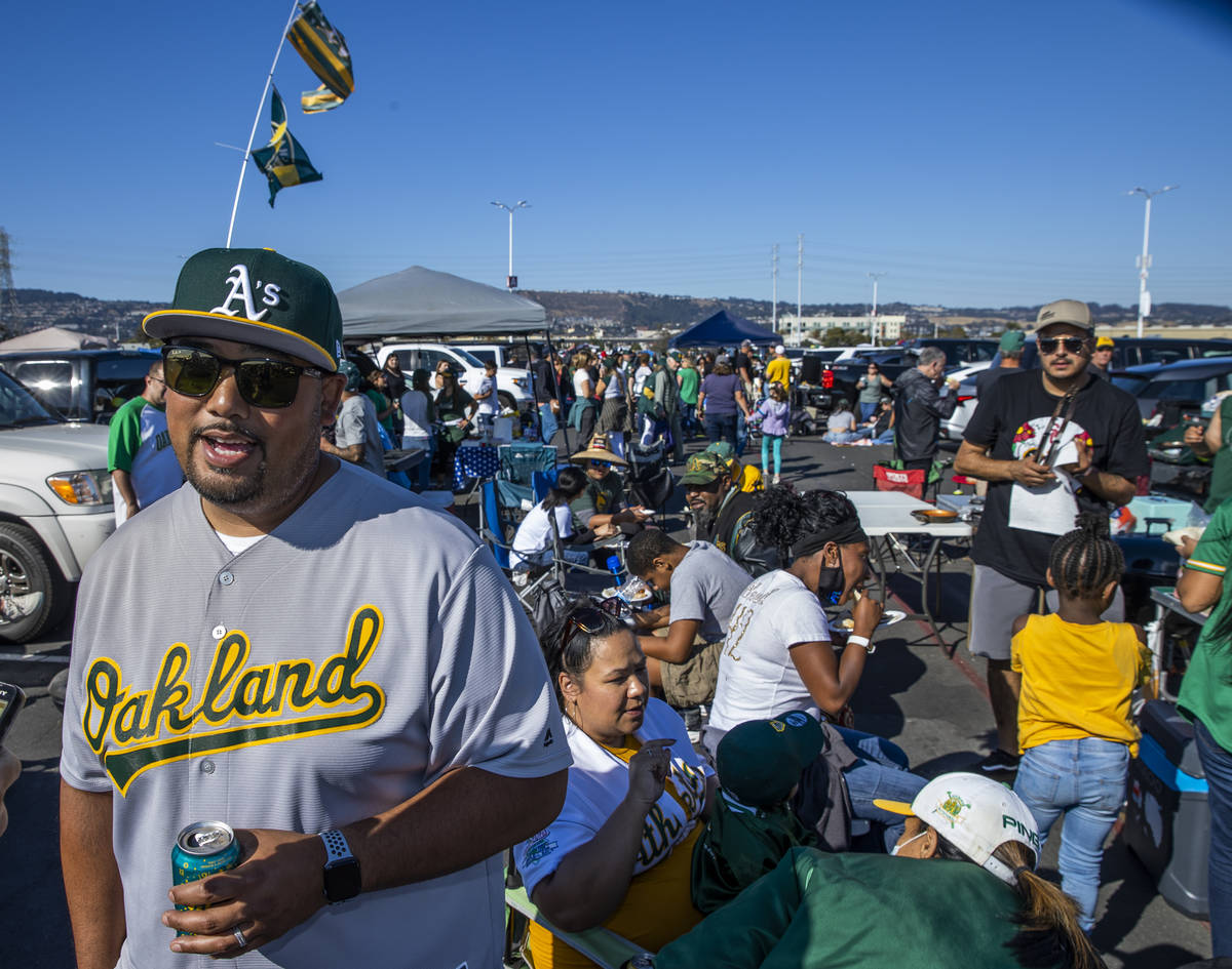 Oakland A‘s fan Chris Crisolo enjoy a tailgate with family and friends in the parking lot of ...