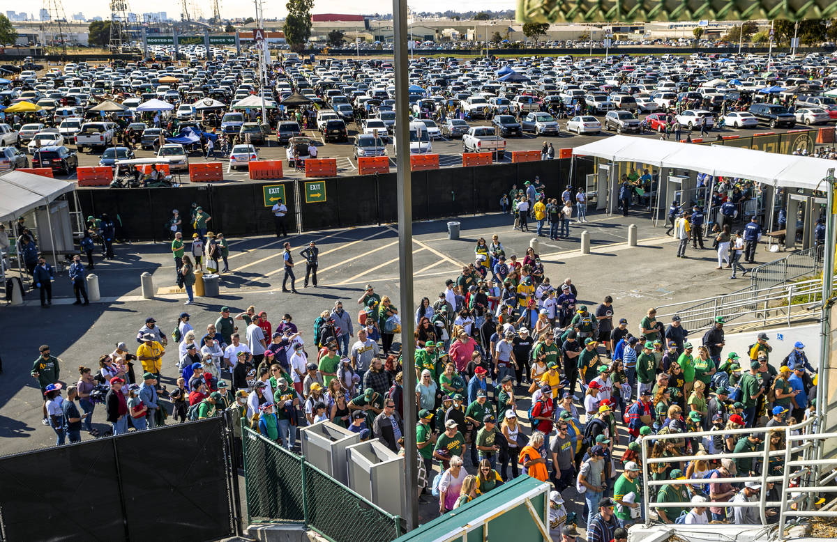 Oakland A‘s fans pack the entrance to RingCentral Coliseum as they enter to to see their team ...