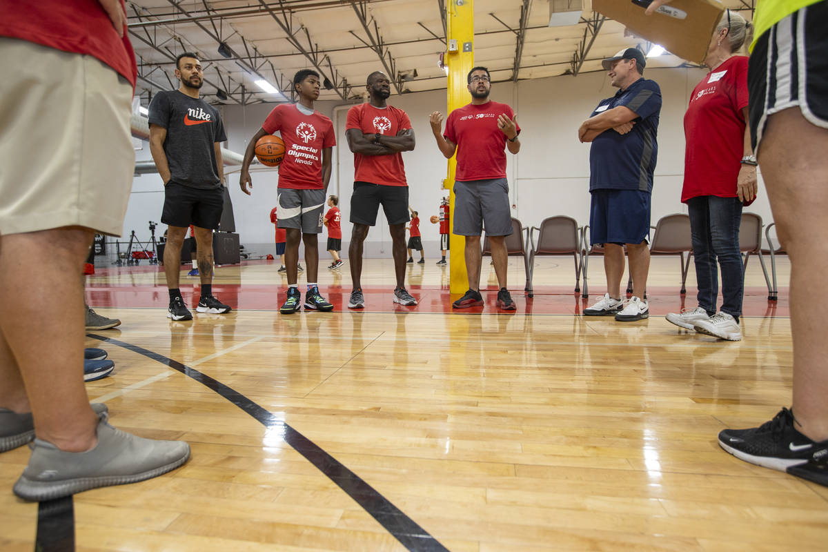 Director of Programs Harry Mong, center right, introduces two-time NBA Slam Dunk Champion Jaso ...