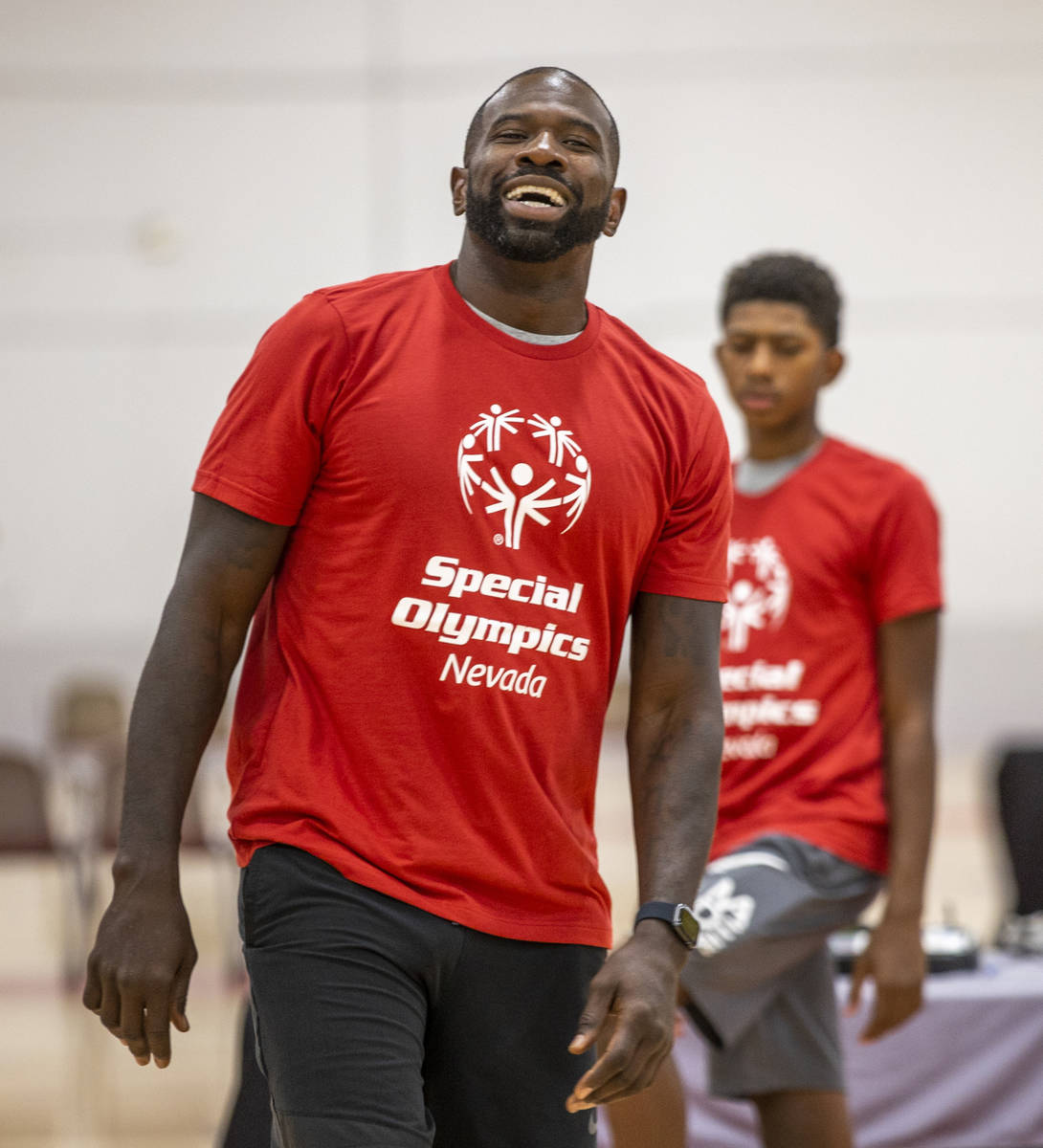 Two-time NBA Slam Dunk Champion Jason Richardson laughs with some of the players as the Special ...