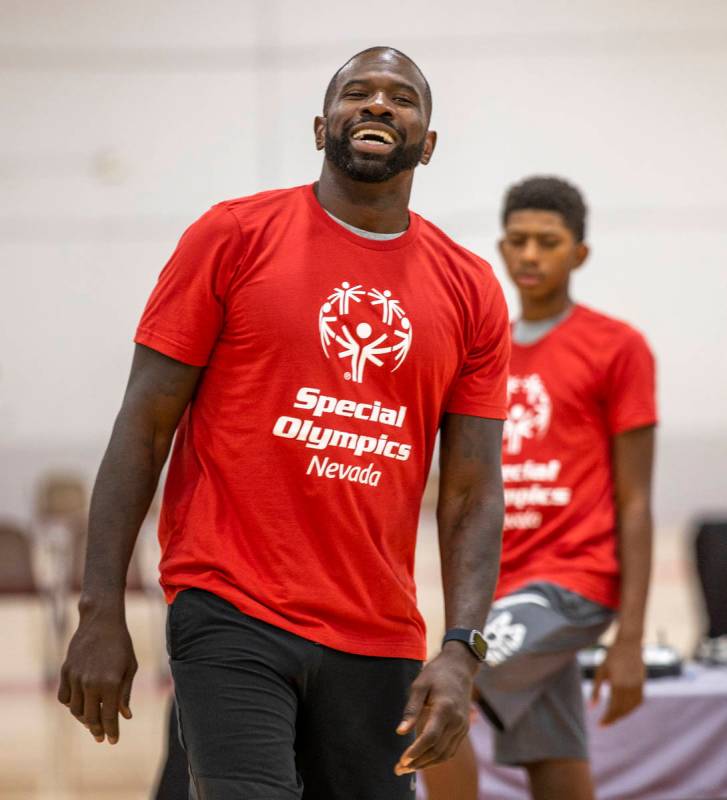 Two-time NBA Slam Dunk Champion Jason Richardson laughs with some of the players as the Special ...