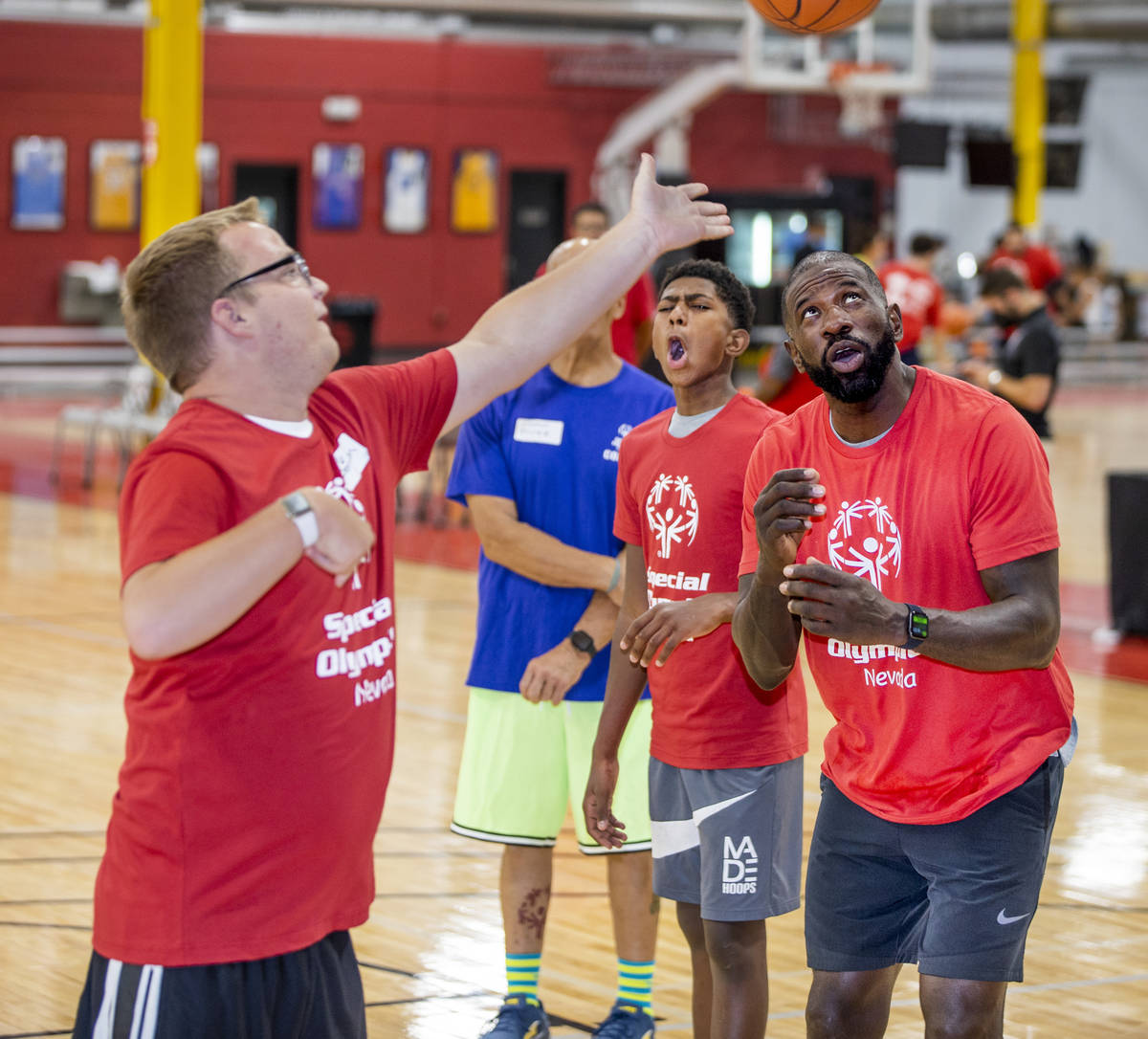 Denton Dorn, left, gets off a shot under the watchful eye of two-time NBA Slam Dunk Champion Ja ...