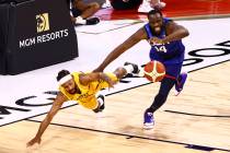 Australia's Patty Mills, left, and USA’s Draymond Green (14) battle for a loose ball dur ...