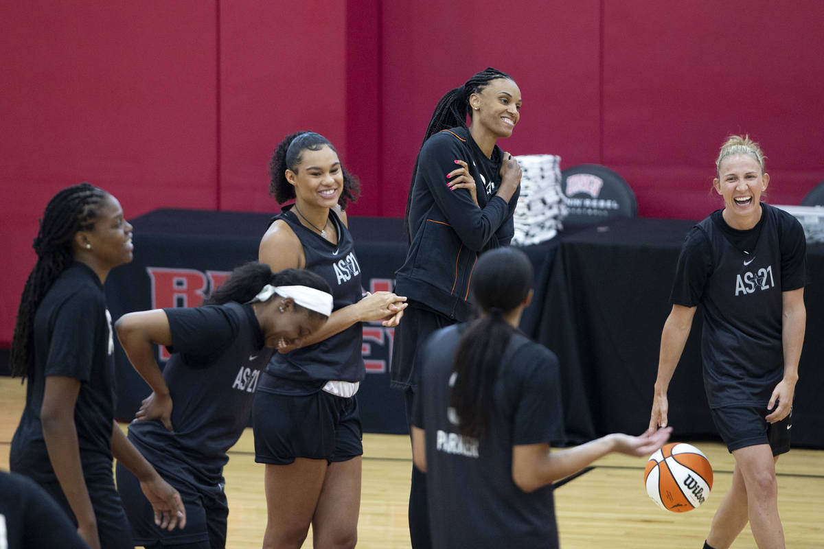 Members of the 2021 Team WNBA laugh during practice, including Courtney Vandersloot, right, DeW ...