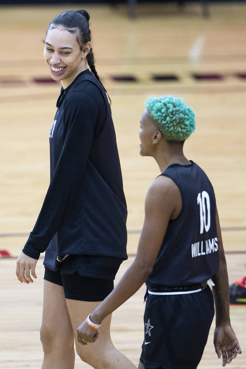 Dearica Hamby, left, who plays for the Las Vegas Aces in the WNBA, laughs alongside Courtney Wi ...