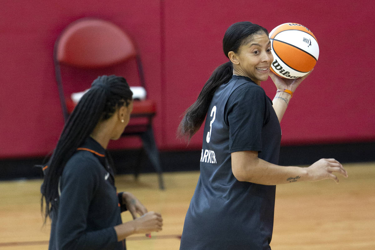 Candace Parker, right, dribbles around DeWanna Bonner during a 2021 Team WNBA practice in Mende ...