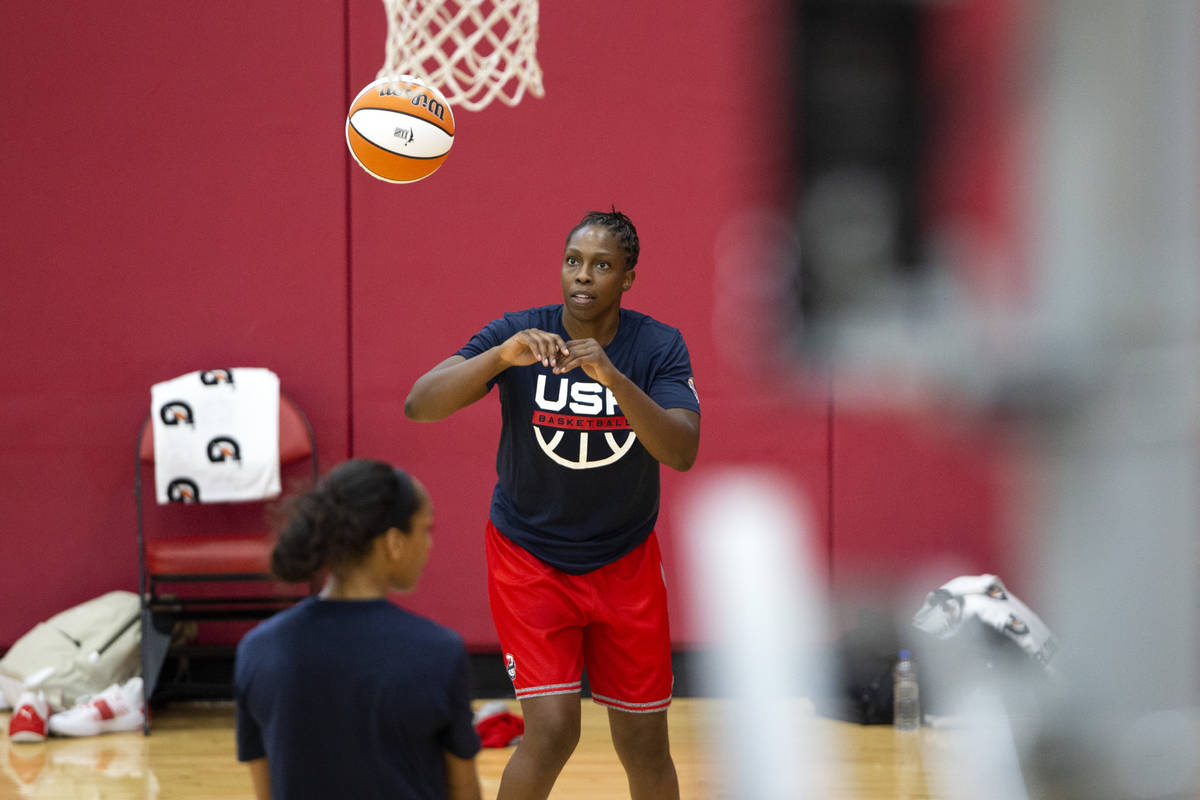 Chelsea Gray, center, practices with her teammate A'ja Wilson, left, during a 2021 USA Basketba ...