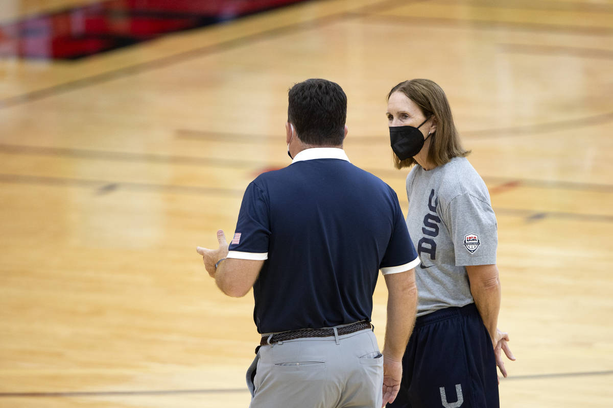 Assistant coach Cheryl Reeve, right, speaks with another staff member during a 2021 USA Basketb ...