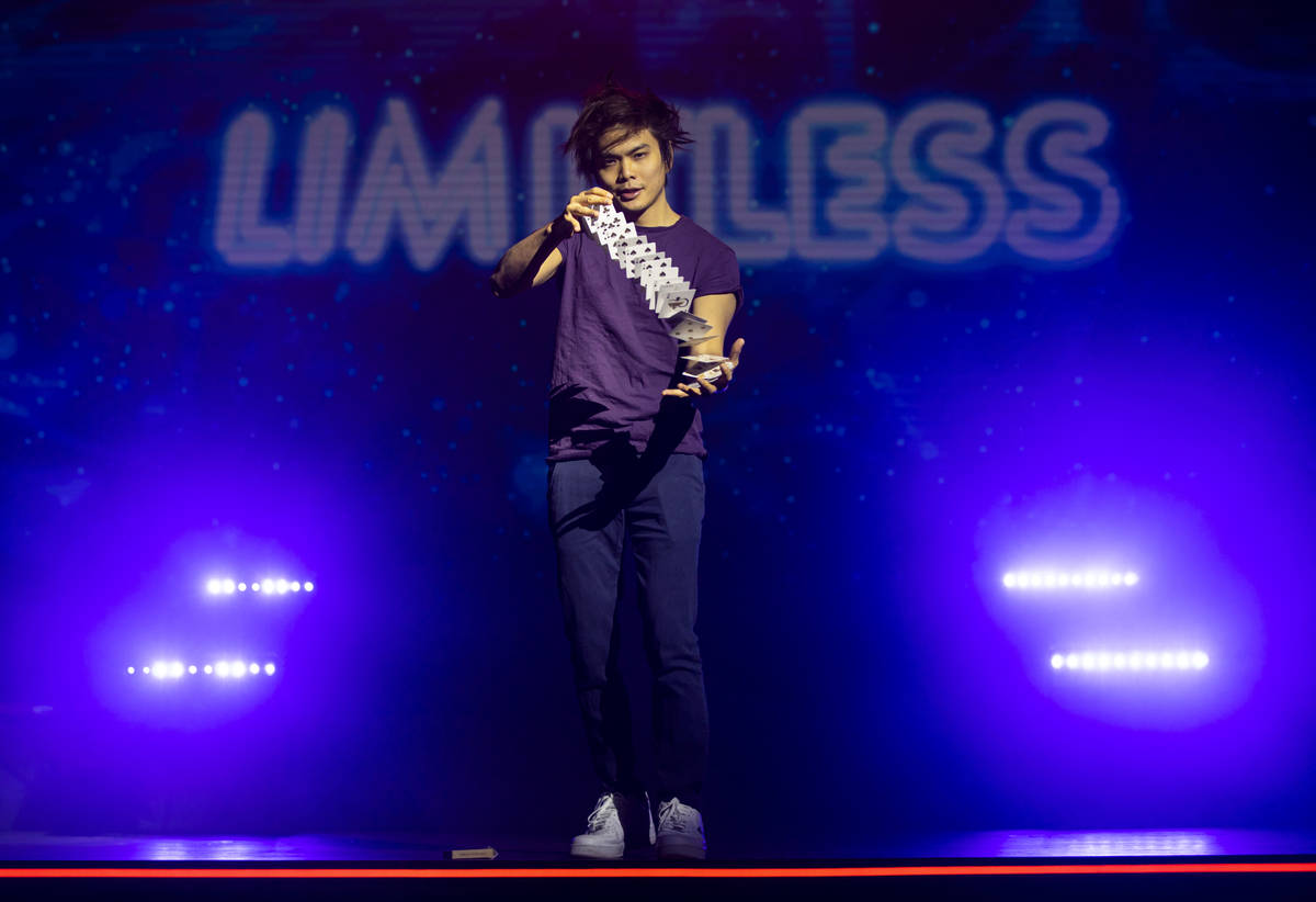 Illusionist Shin Lim is silhoutted onstage ahead of the reopening