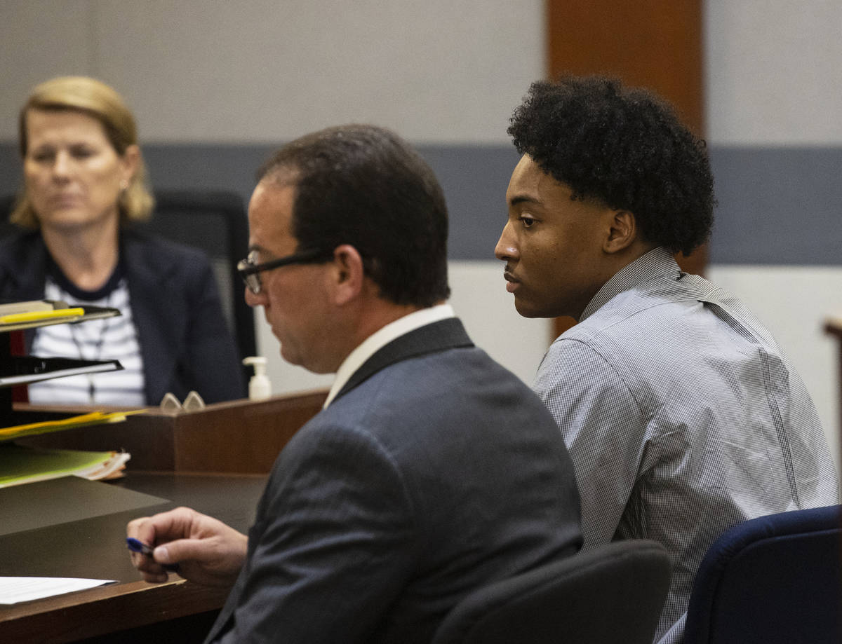 Former Bishop Gorman High School basketball standout Zaon Collins, right, appears in court with ...