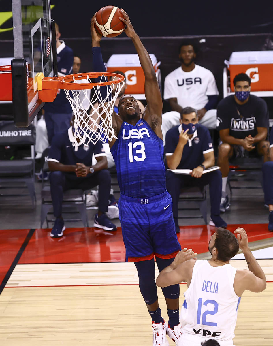 USA's Bam Adebayo (13) dunks the ball in front of Argentina’s Marcos Delia (12) during t ...