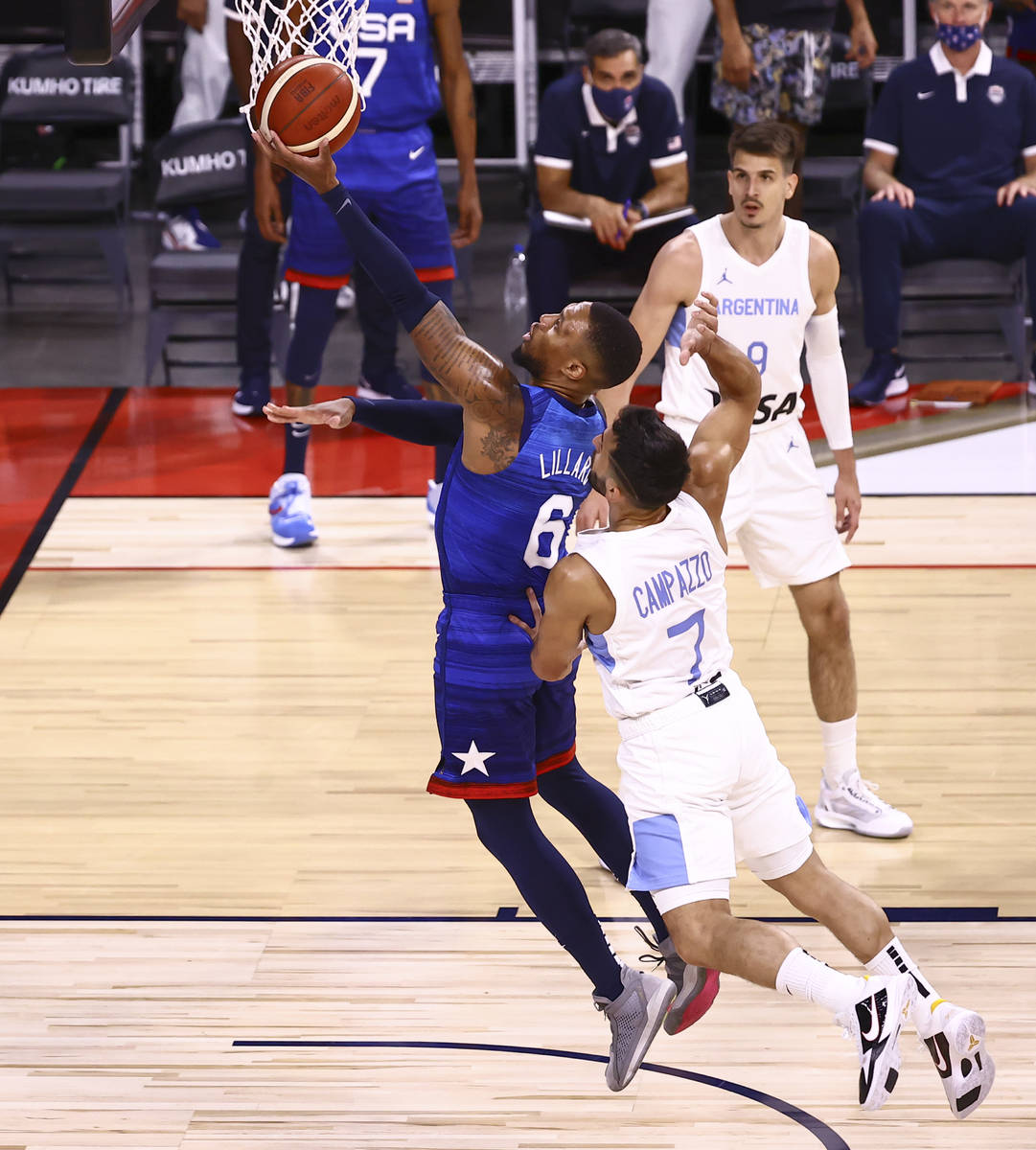 USAÕs Damian Lillard (6) goes to the basket past ArgentinaÕs Facundo Campazzo (7) dur ...