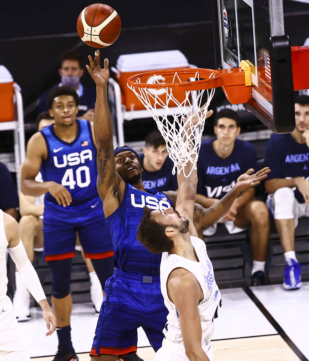 USA’s Bradley Beal (4) shoots around Argentina’s Marcos Delia (12) during the sec ...