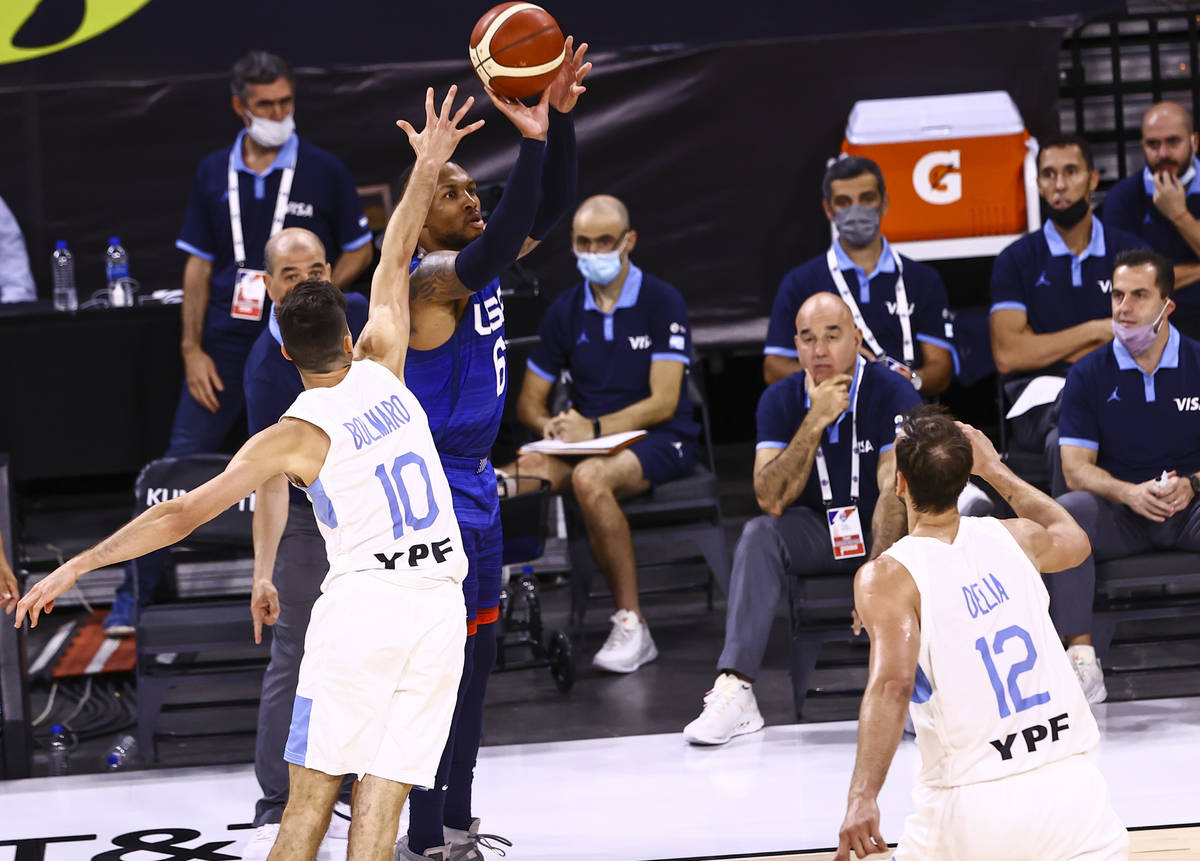 USAÕs Damian Lillard (6) shoots as ArgentinaÕs Leandro Bolmaro (10) defends during th ...