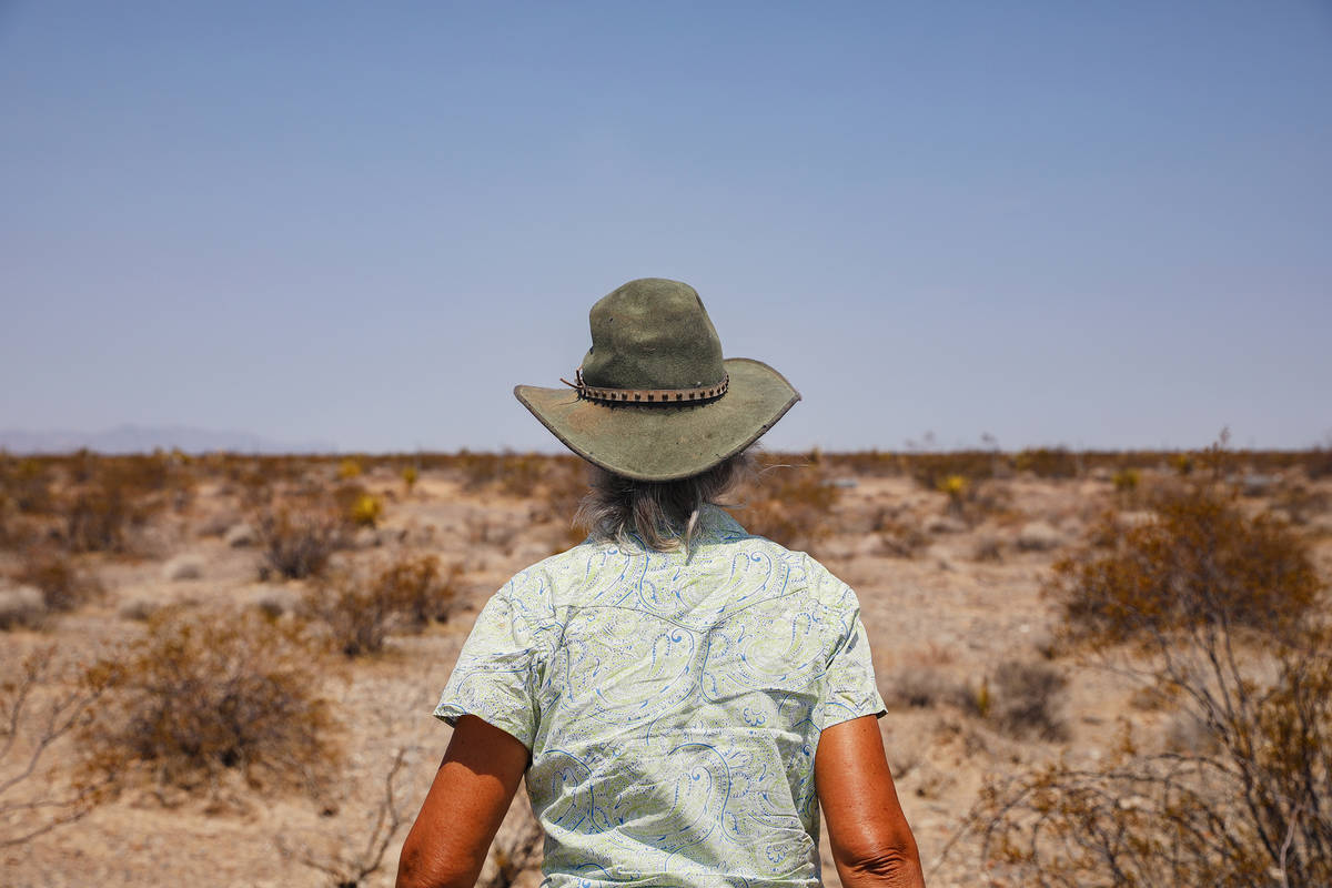 Laura Cunningham walks toward the fence of the future Yellow Pine Solar project, which will cov ...