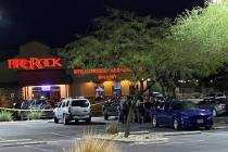 Las Vegas police congregate in front of the FireRock Steakhouse in northwest Las Vegas early Tu ...