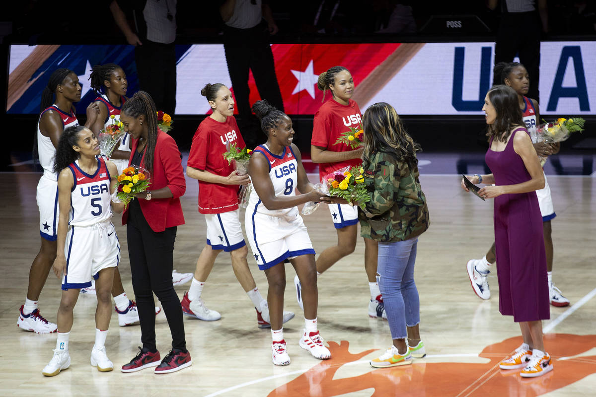 Current players present bouquets of flowers to members of the 1996 Olympic women's basketball t ...