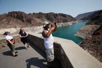 Eric Bonner of Lansing, Michigan, visits the Hoover Dam in the Arizona side with his mother-in ...
