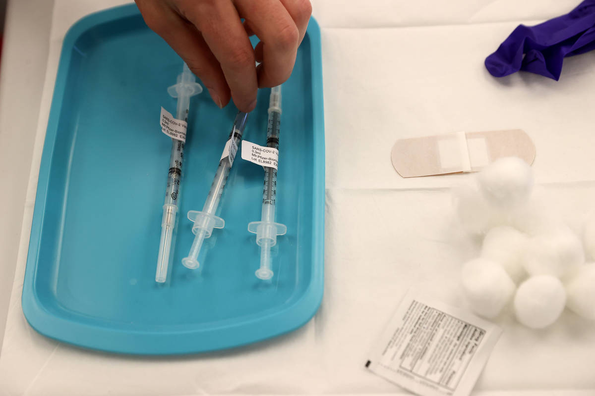 Nursing student Stephanie Soiberg prepares to give a COVID-19 vaccine during a UNLV Medicine cl ...