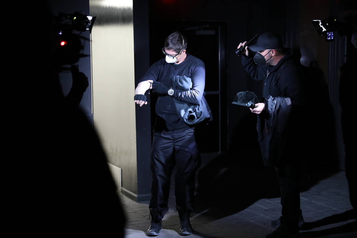Zak Bagans examines his arm after feeling an unusual sensation during their investigation. (Dis ...
