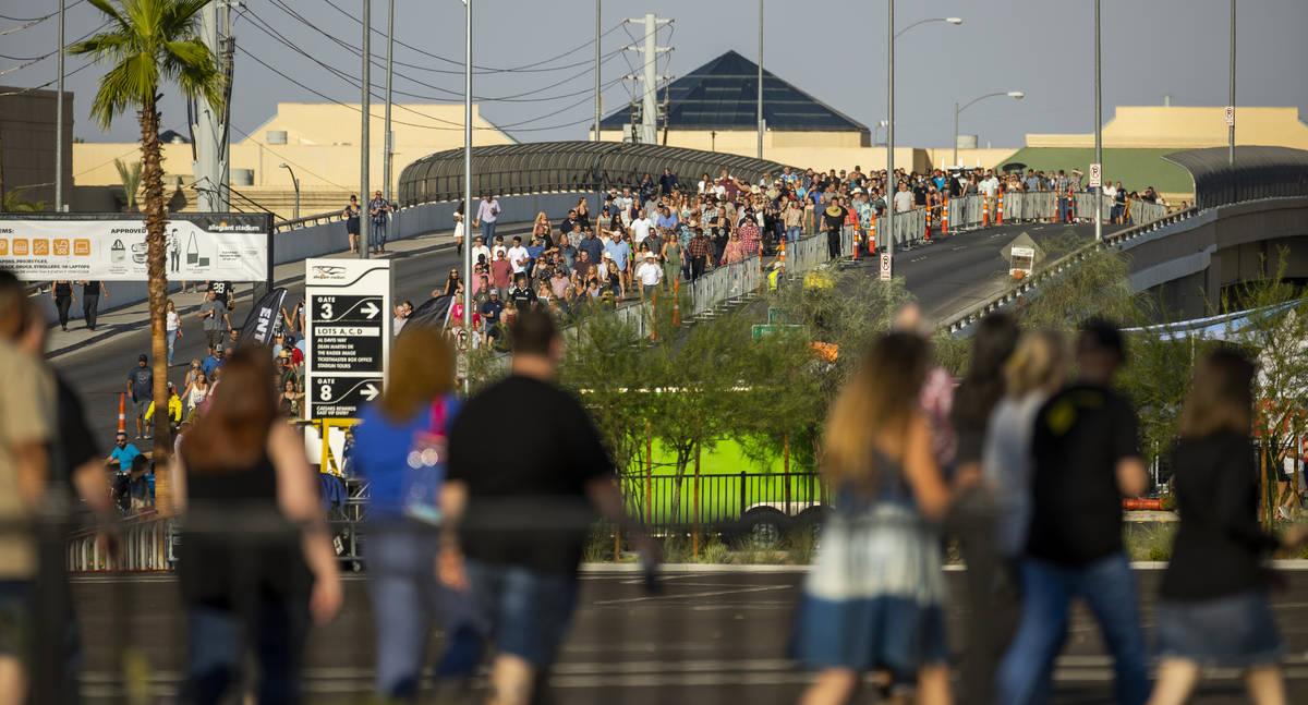 Fans make their way in the heat to the Garth Brooks concert at Allegiant Stadium on Friday, Jul ...