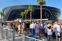 Attendees for a Garth Brooks concert line up at Allegiant Stadium about two hours before the sc ...