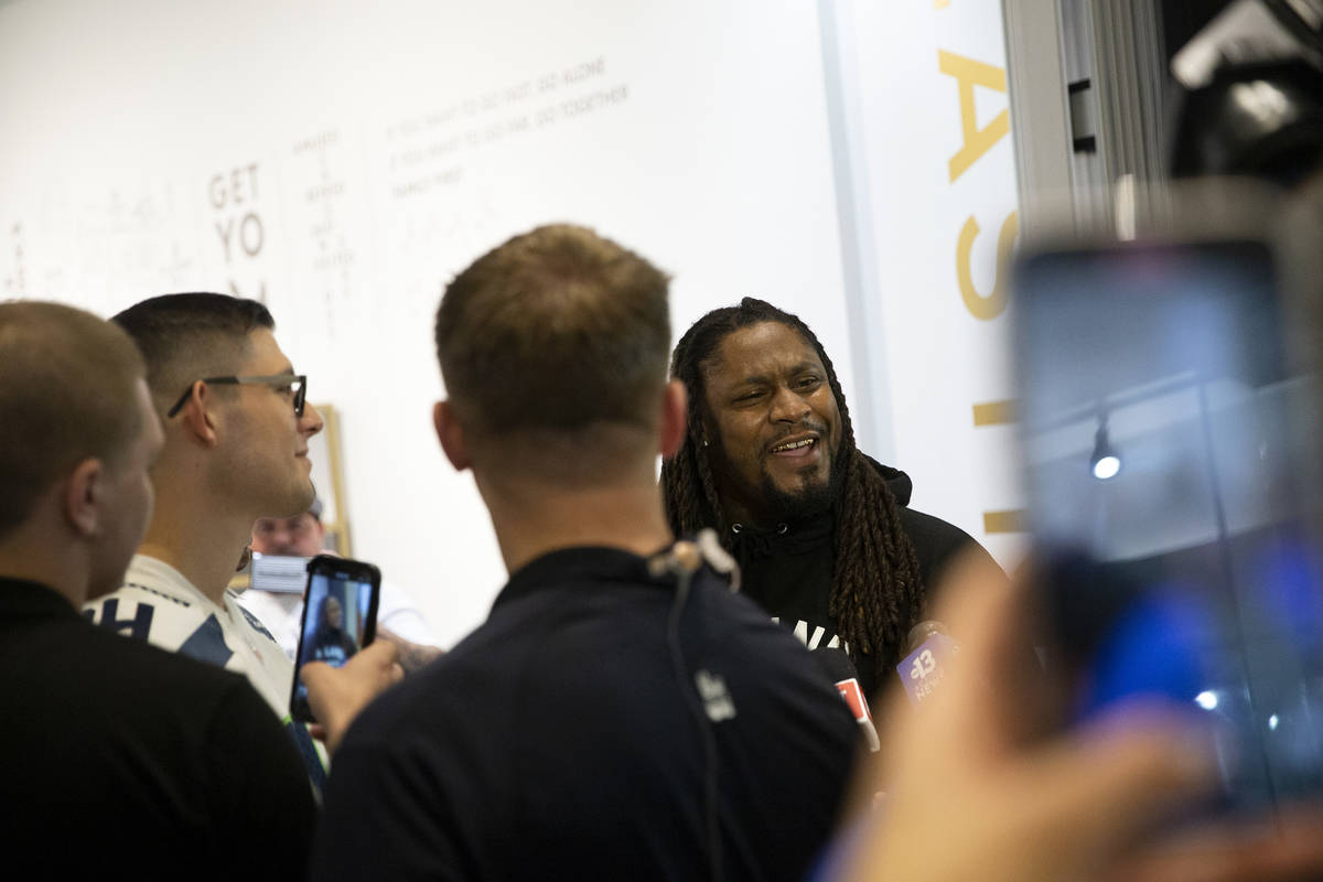 NFL running back Marshawn Lynch speaks to media at the opening of his store, Beast Mode, in The ...