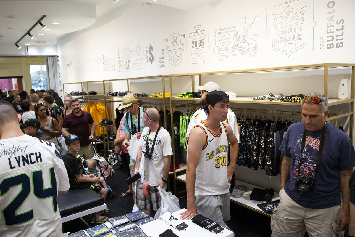 Fans and customers wait in line at the opening of NFL running back Marshawn Lynch's store, Beas ...