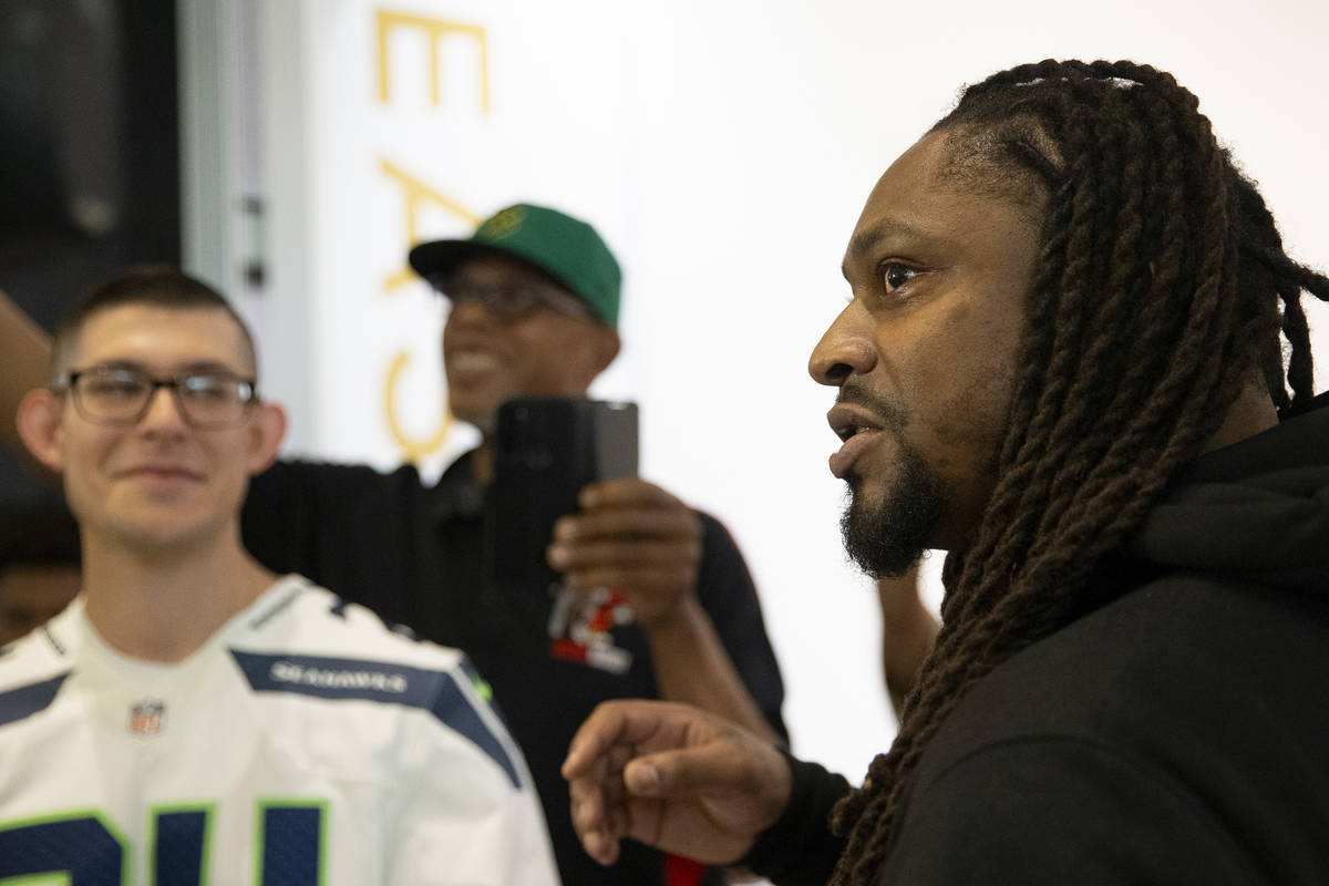 NFL running back Marshawn Lynch speaks to media at the opening of his store, Beast Mode, in The ...