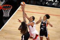 Phoenix Mercury center Brittney Griner (42) blocks a shot by Las Vegas Aces center Liz Cambage ...