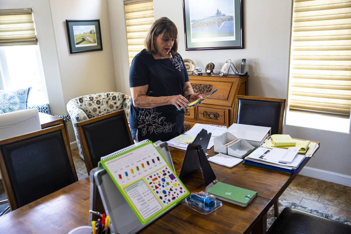 Donna Peterson shows some of the different items used to help her husband, Byron Peterson, not ...