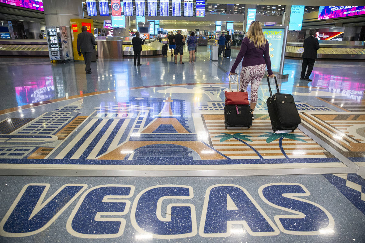 Travelers at McCarran International Airport Terminal 1 in Las Vegas, Thursday, May 13, 2021. (E ...