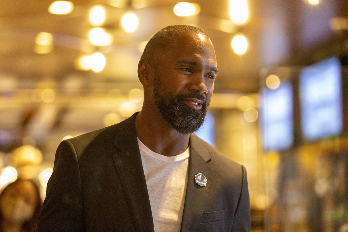 Former Raiders defensive back and Hall of Famer Charles Woodson is interviewed at the ribbon cu ...