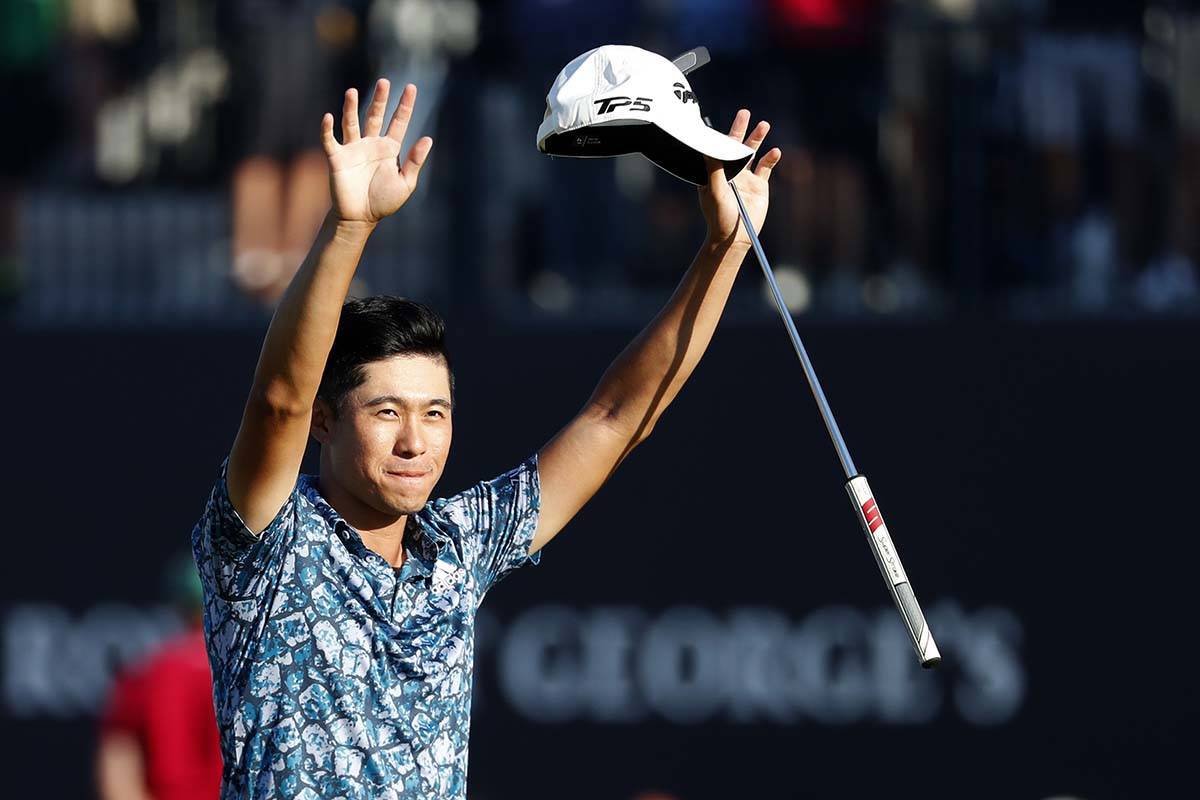 United States' Collin Morikawa celebrates on the 18th green after winning the British Open Golf ...