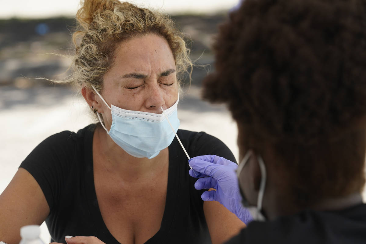 FILE - In this Thursday, July 15, 2021 file photo, Paola Preciado gets a COVID-19 test in North ...