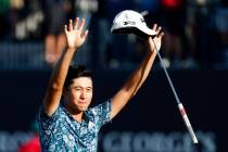 United States' Collin Morikawa celebrates on the 18th green after winning the British Open Golf ...