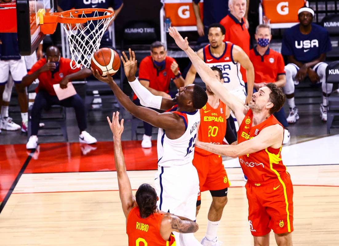 United States center Bam Adebayo (13) goes to the basket past Spain center Pau Gasol (4) during ...