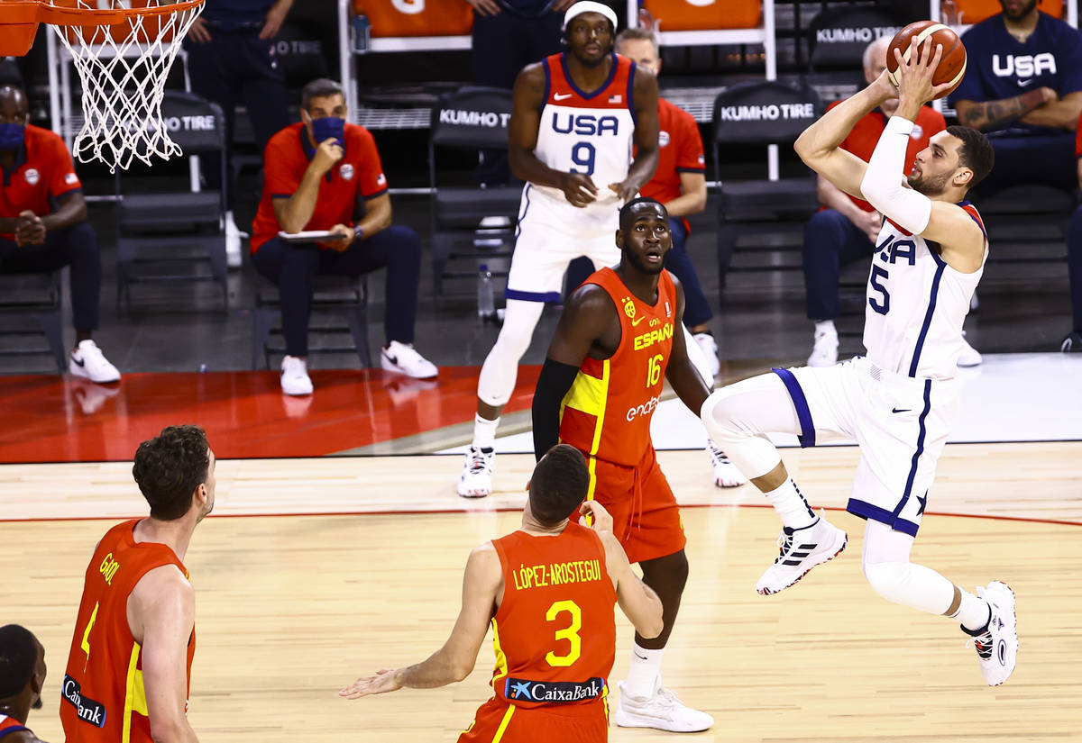 United States guard Zach Lavine (5) shoots in front of Spain forward Usman Garuba (16) during t ...