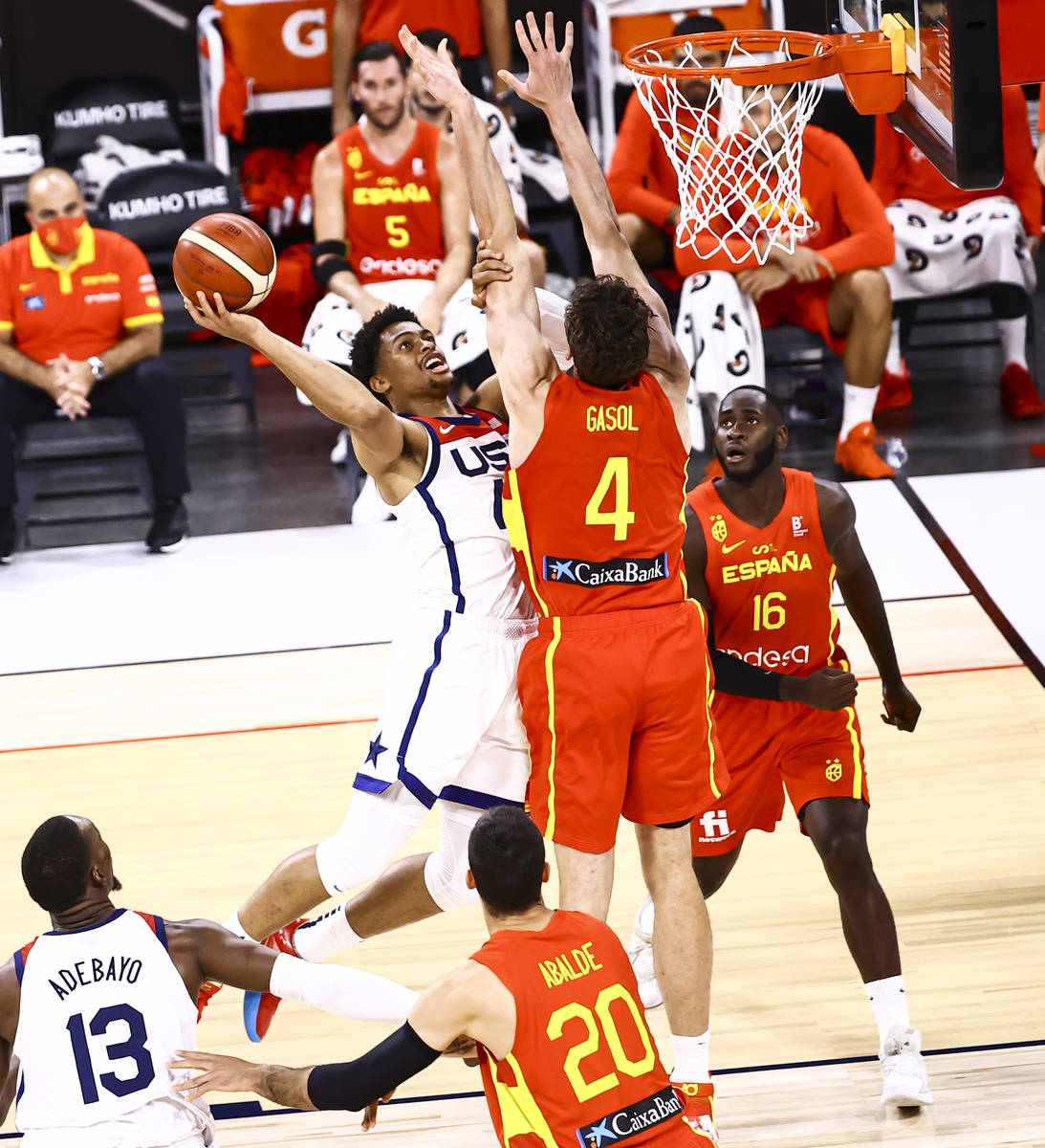 United States guard Keldon Johnson lays up the ball against Spain center Pau Gasol (4) during t ...