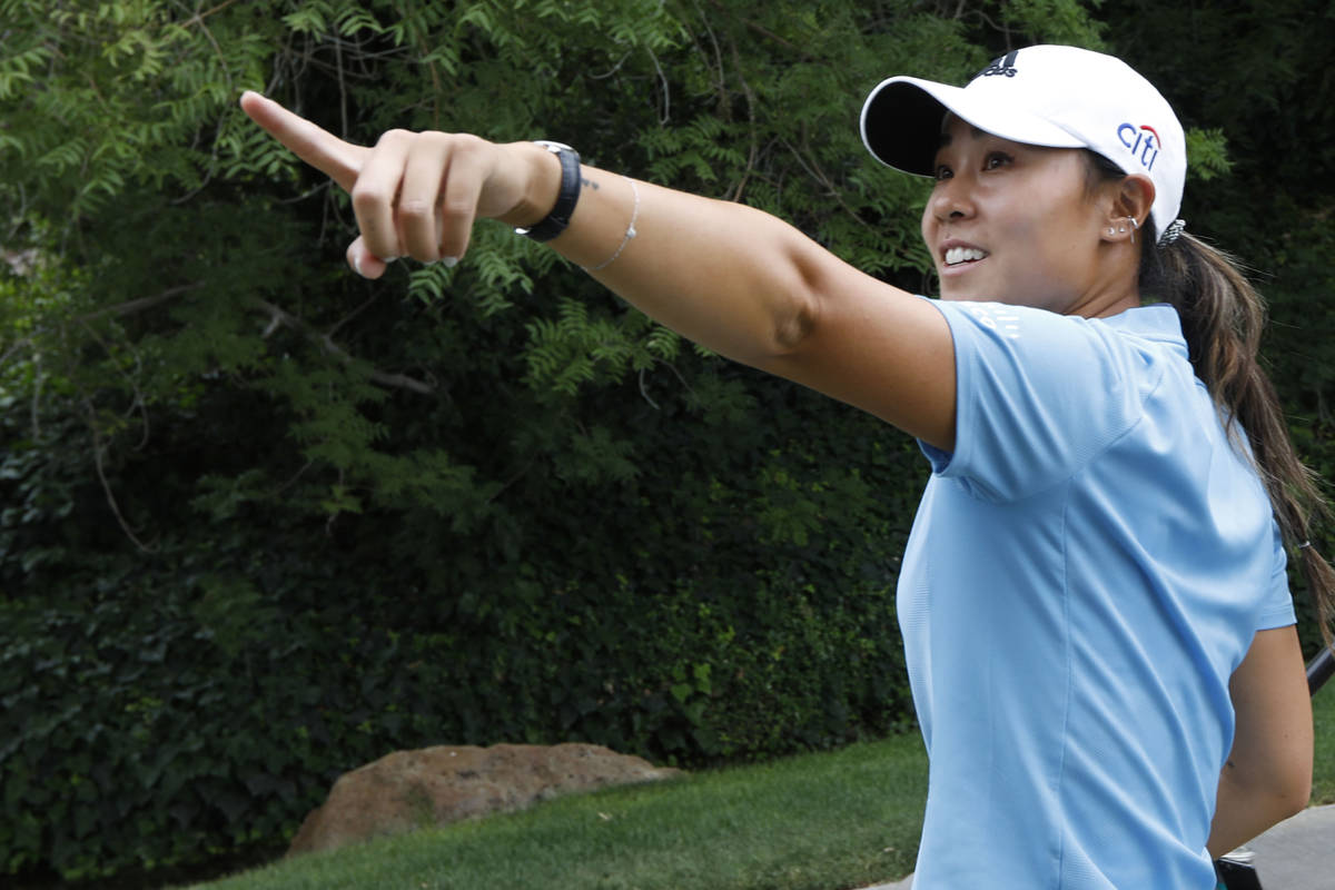 Danielle Kang gestures after finishing the 18th hole during the fourth round of the Bank of Hop ...