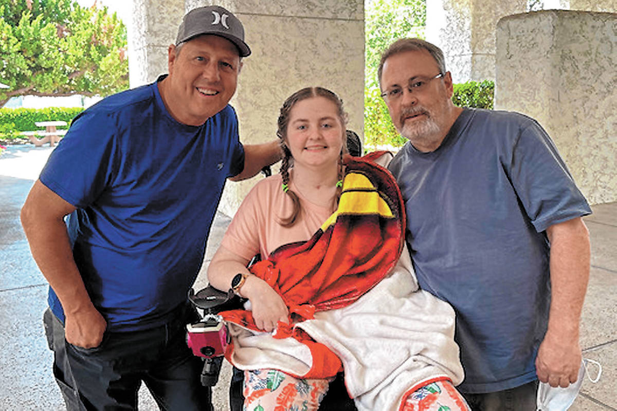 Emma Burkey with her father Russ, right, and Bret Johnson, left. (Burkey Family)