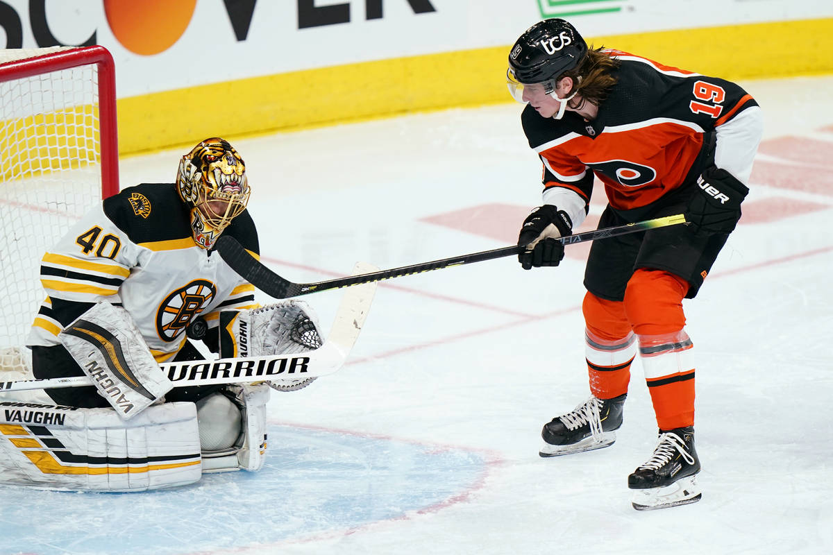 Philadelphia Flyers' Nolan Patrick (19) cannot get a shot past Boston Bruins' Tuukka Rask (40) ...