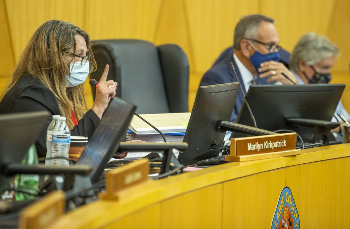 Clark County Commission Chairman Marilyn Kirkpatrick, left, instructs people during public comm ...