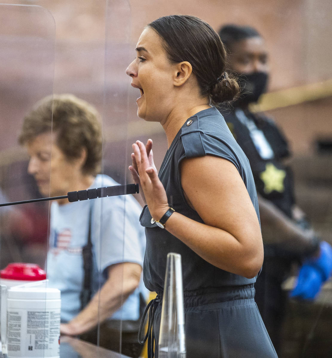 Former business owner Emily Palmer cries while speaking during a Clark County Commission meetin ...