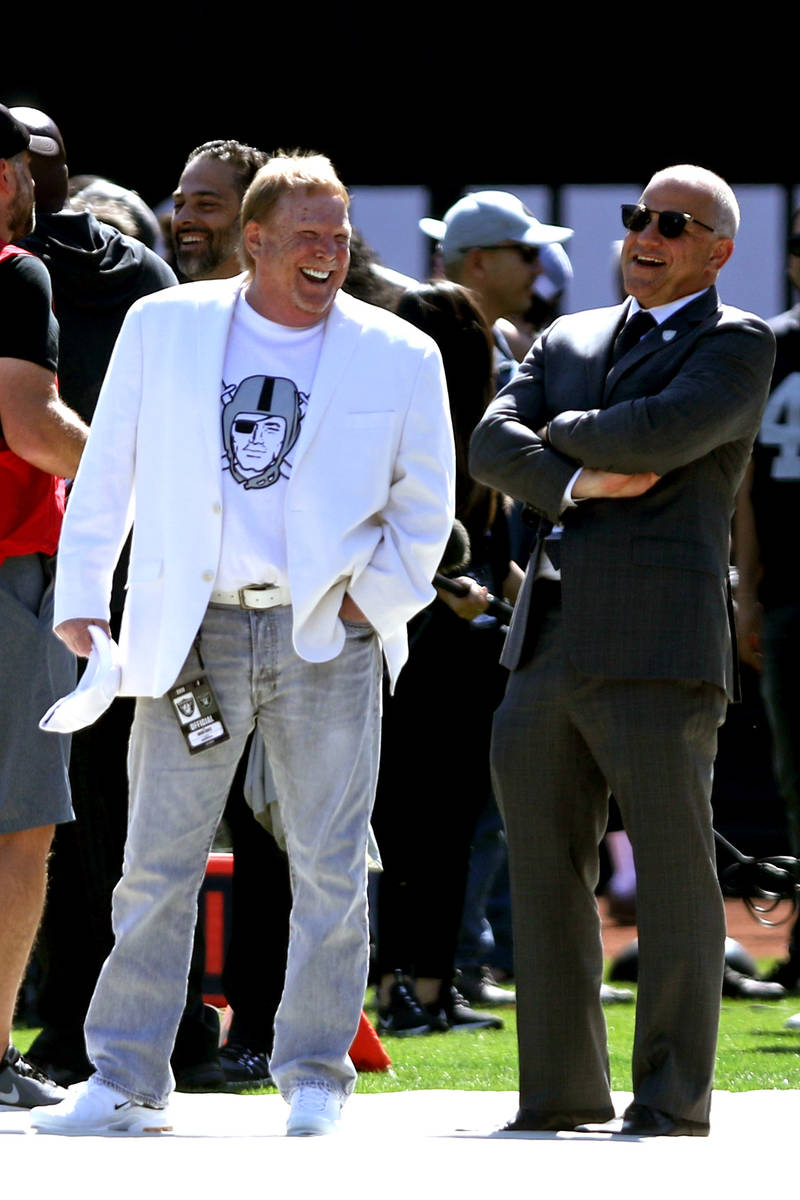 Raiders owner Mark Davis, left, and president Marc Badain share a laugh before an NFL game agai ...