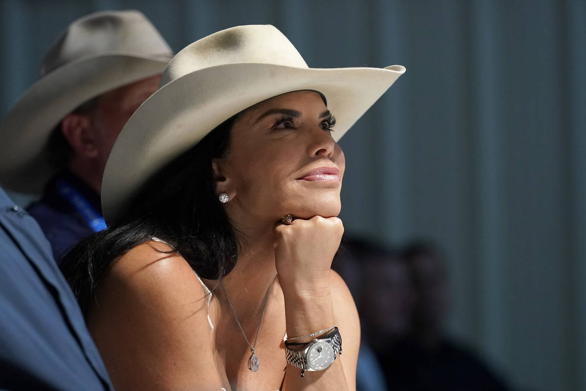 Lauren Sanchez, center, watches as Jeff Bezos, founder of Amazon and space tourism company Blue ...