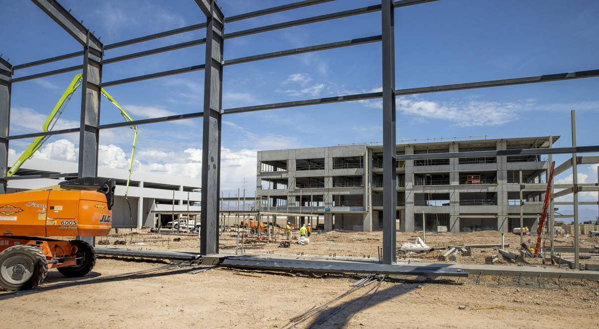 Steel from the Market Hall, near, with Office Building #1, far, under construction at UnCommons ...