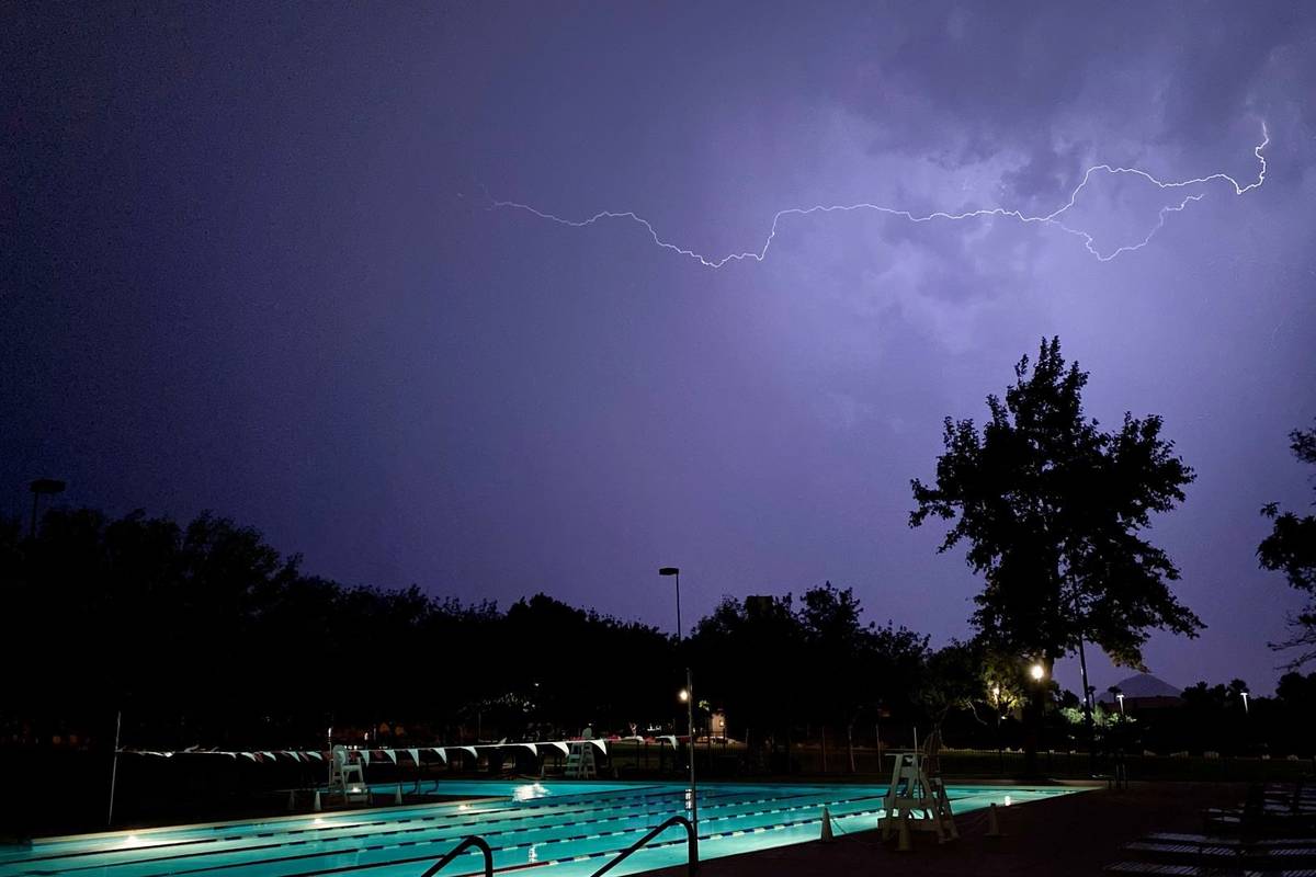 Lightning illuminates the sky above the Trails Pool in Summerlin on Tuesday, July 20, 2021. (Co ...